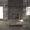 large stone fireplace out of creek stone The hearth was solid piece cut out of the homeowners creek bed.